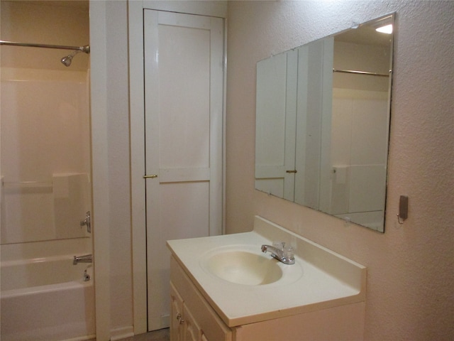 bathroom featuring vanity and tub / shower combination