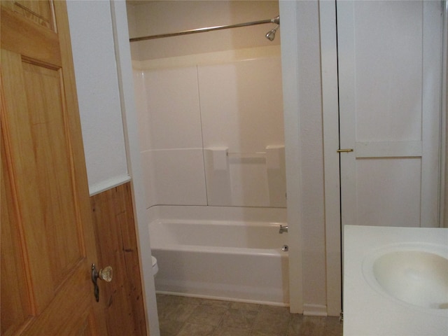 full bathroom with  shower combination, vanity, and toilet