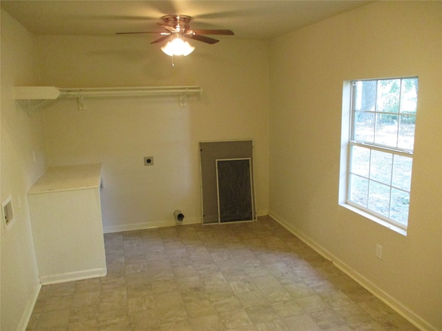 laundry area featuring a healthy amount of sunlight, ceiling fan, and electric dryer hookup