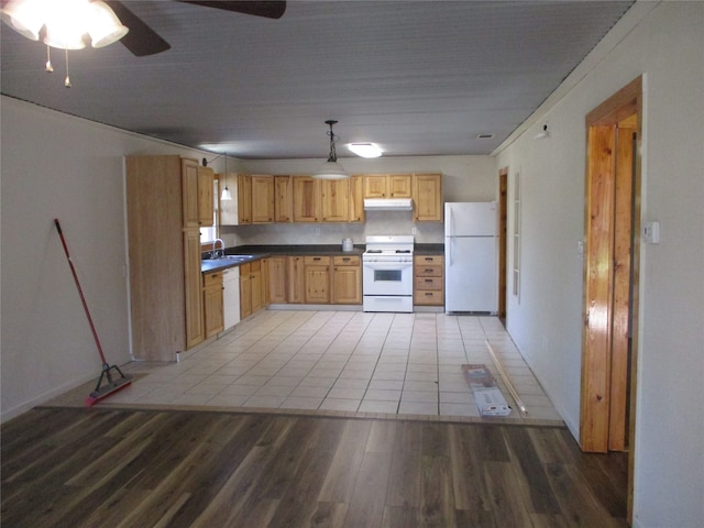 kitchen with hanging light fixtures, ceiling fan, light wood-type flooring, sink, and white appliances