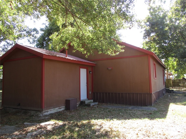 view of home's exterior with a yard