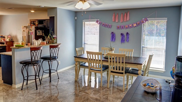 dining room featuring ceiling fan