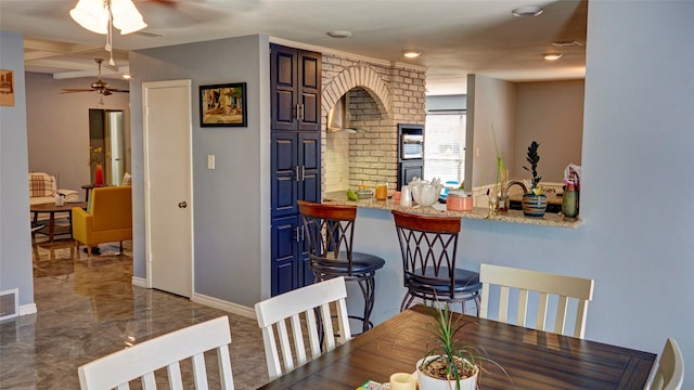 dining room featuring ceiling fan