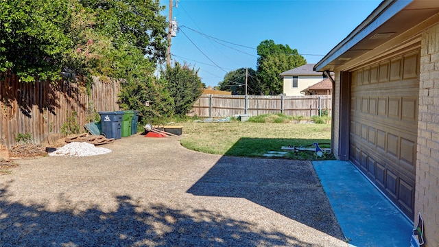 view of yard with a garage