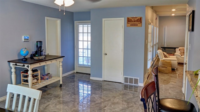 foyer featuring ceiling fan