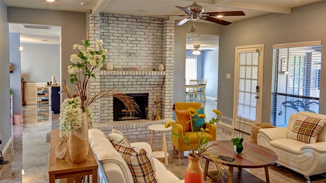 living room featuring a wealth of natural light, beamed ceiling, a fireplace, and ceiling fan