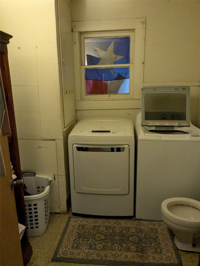 laundry room with separate washer and dryer