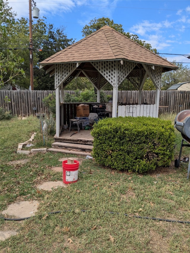 view of yard with a gazebo and a wooden deck