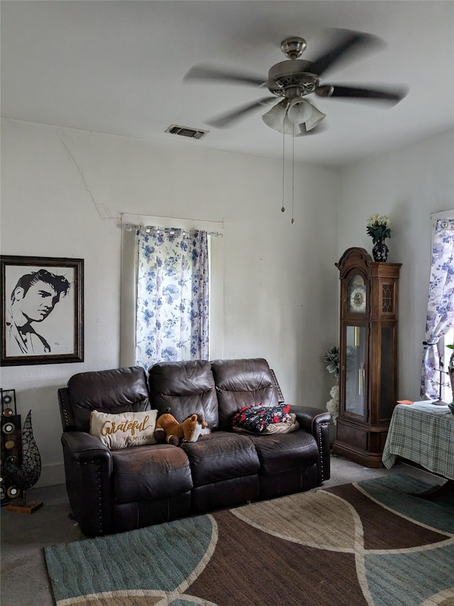 living room with carpet and ceiling fan