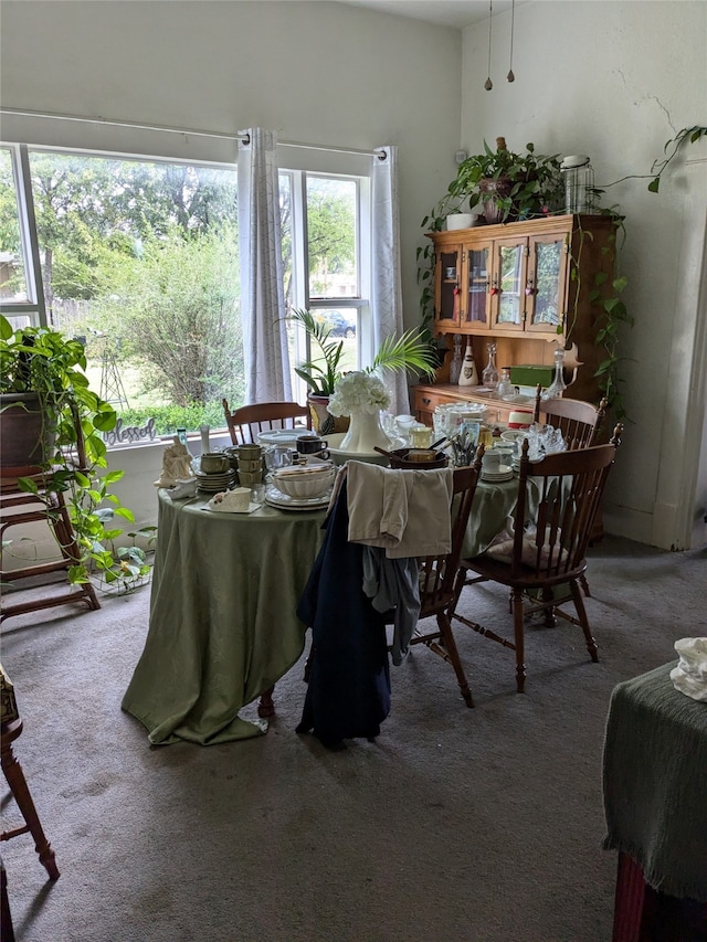 view of carpeted dining area