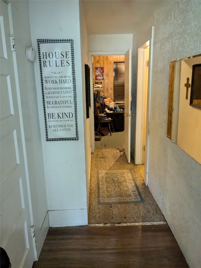 corridor featuring dark wood-type flooring