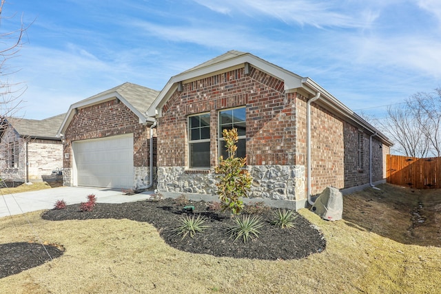 view of front of home with a garage and a front lawn