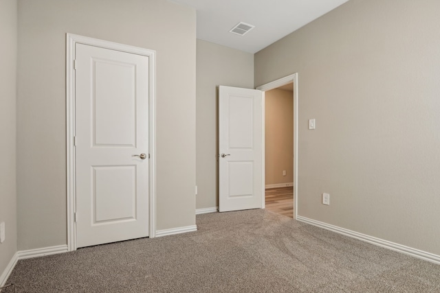 unfurnished bedroom featuring carpet