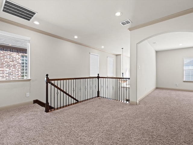 corridor featuring crown molding and carpet floors