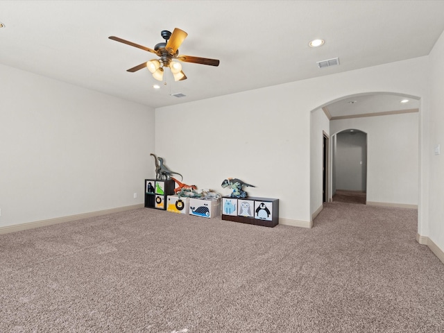 3809 S Brookridge Ct, Bedford, TX 76021 - game room featuring carpet floors, arched walkways, a ceiling fan, baseboards, and visible vents
