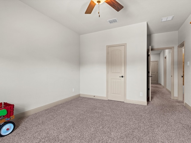 unfurnished bedroom with ceiling fan and carpet floors