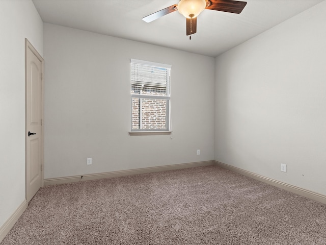 spare room featuring carpet flooring and ceiling fan