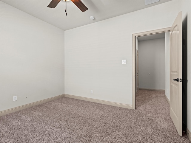 carpeted empty room featuring ceiling fan