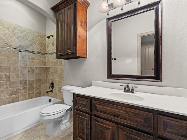 full bathroom with toilet, tiled shower / bath combo, and vanity