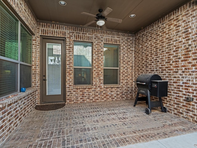 view of patio featuring ceiling fan and a grill