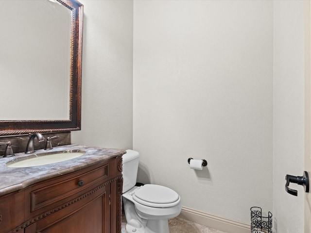 3809 S Brookridge Ct, Bedford, TX 76021 - half bathroom featuring vanity, baseboards, tile patterned floors, and toilet