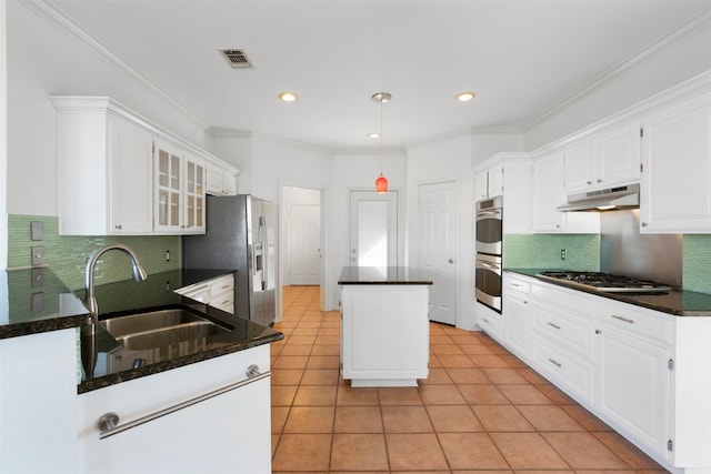 kitchen with light tile patterned flooring, white cabinets, stainless steel appliances, and sink