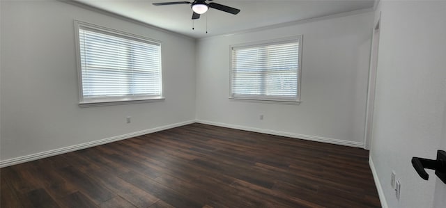 empty room with crown molding, a healthy amount of sunlight, dark hardwood / wood-style flooring, and ceiling fan