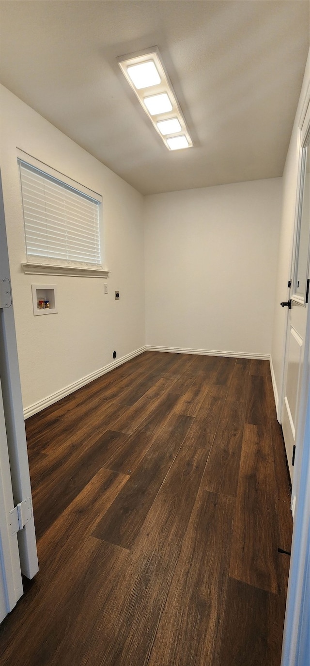 unfurnished room with dark hardwood / wood-style floors