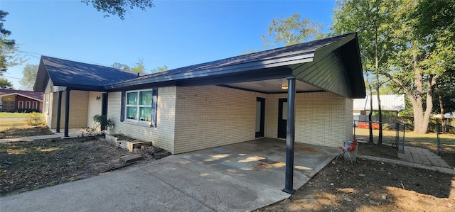 view of property exterior with a carport