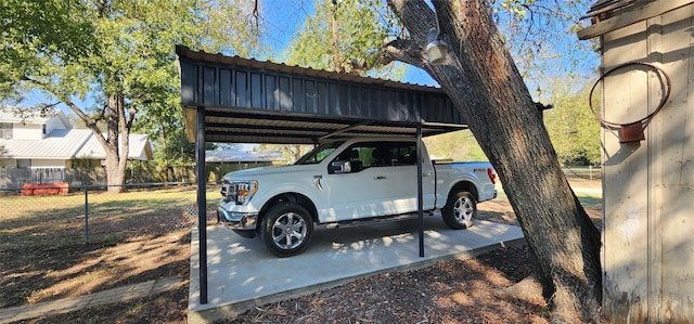 view of parking / parking lot featuring a carport