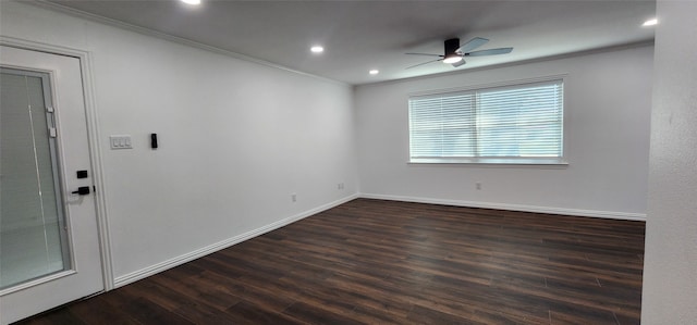 empty room featuring ceiling fan, ornamental molding, and dark hardwood / wood-style floors