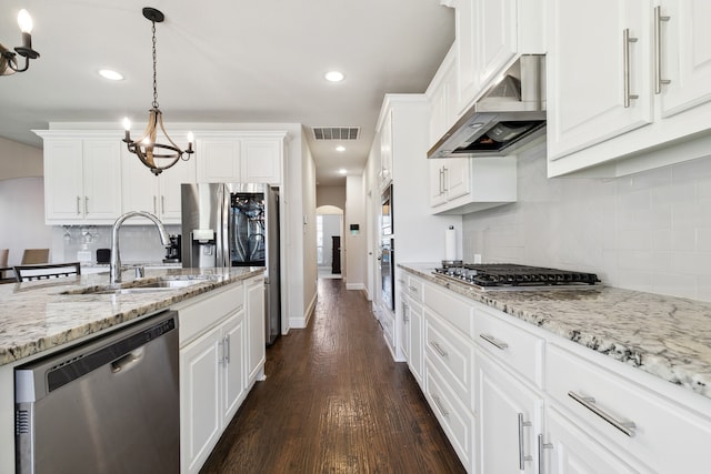 kitchen featuring white cabinets, stainless steel appliances, sink, and dark hardwood / wood-style flooring