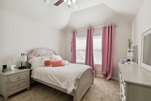 bedroom featuring ceiling fan, light carpet, and vaulted ceiling