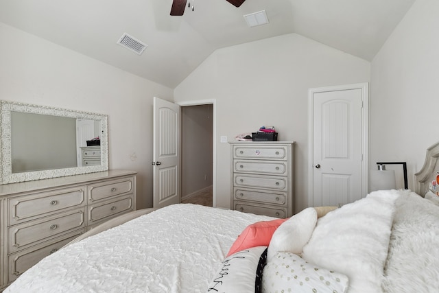 bedroom with lofted ceiling, a closet, and ceiling fan