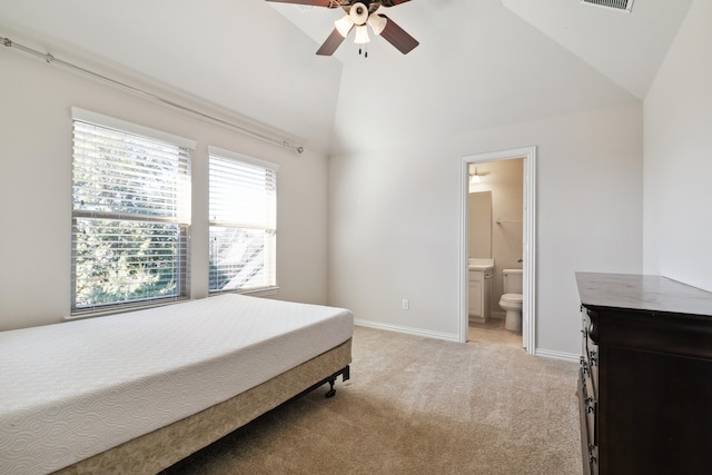 carpeted bedroom featuring ensuite bathroom, high vaulted ceiling, and ceiling fan