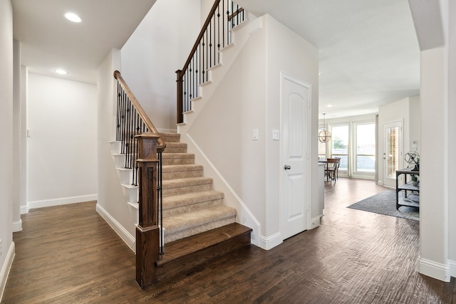 staircase with wood-type flooring