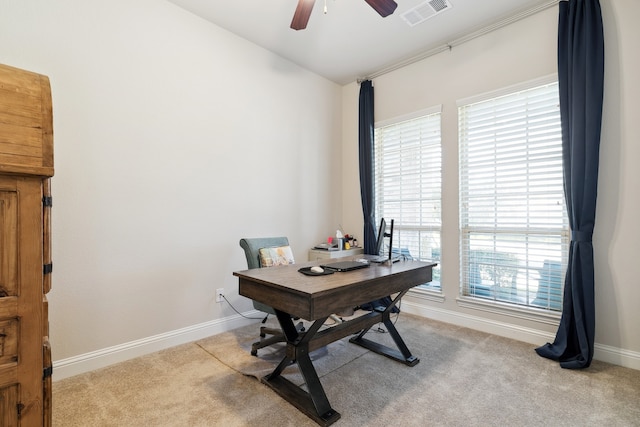 office space featuring light colored carpet and ceiling fan