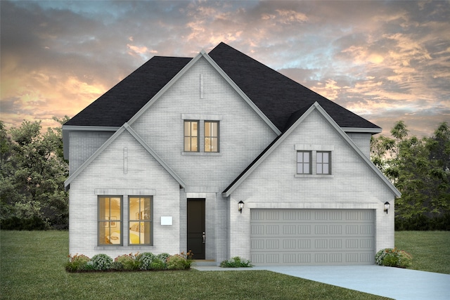 modern farmhouse with a yard and a garage