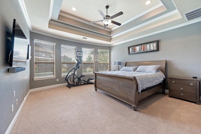 carpeted bedroom with crown molding, a raised ceiling, and ceiling fan