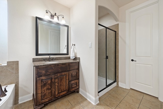 bathroom featuring vanity, separate shower and tub, and tile patterned flooring