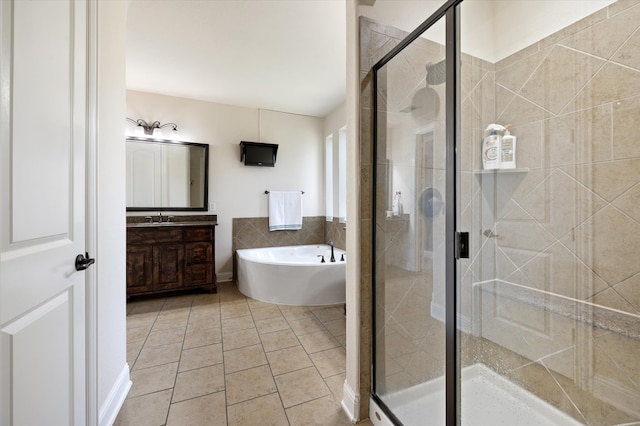 bathroom with vanity, independent shower and bath, and tile patterned floors