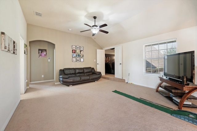 carpeted living room with lofted ceiling and ceiling fan