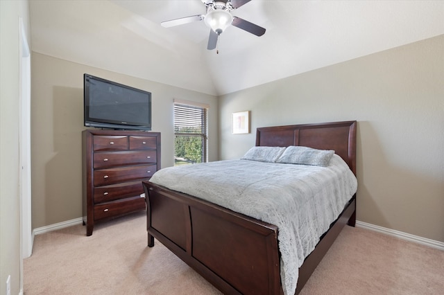 bedroom with ceiling fan, lofted ceiling, and light colored carpet