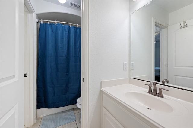 bathroom featuring vanity, a shower with curtain, toilet, and tile patterned flooring