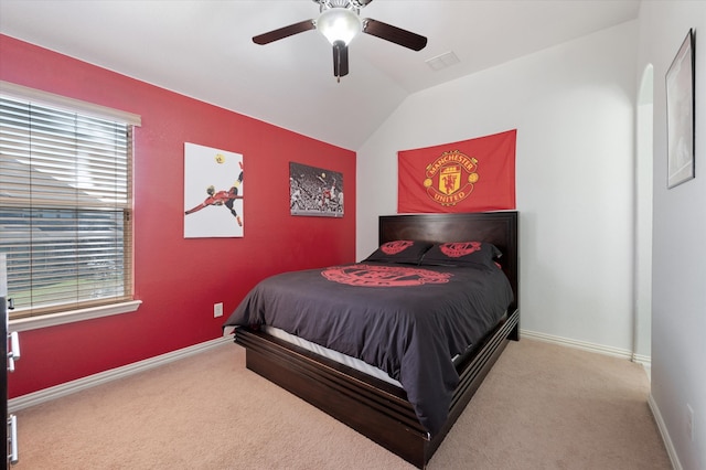 bedroom featuring lofted ceiling, carpet flooring, multiple windows, and ceiling fan