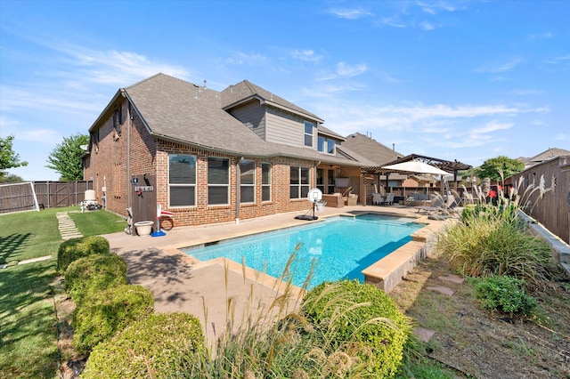 view of swimming pool featuring a patio area and a yard