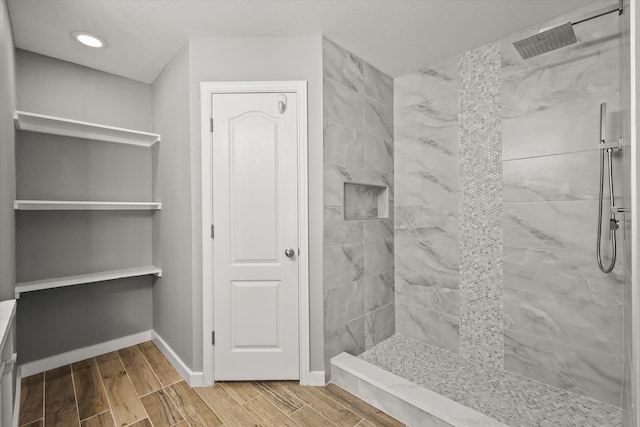 bathroom with tiled shower