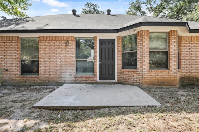 property entrance with a patio