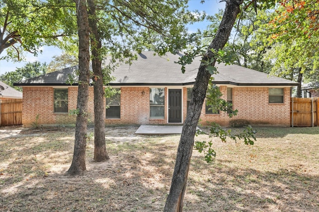 rear view of house featuring a patio