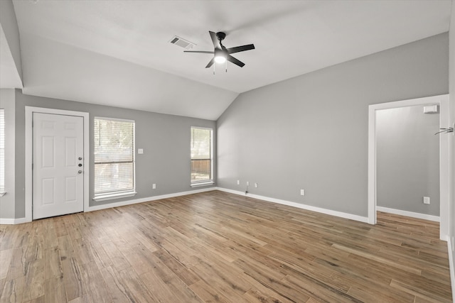 unfurnished living room with lofted ceiling, light hardwood / wood-style floors, and ceiling fan